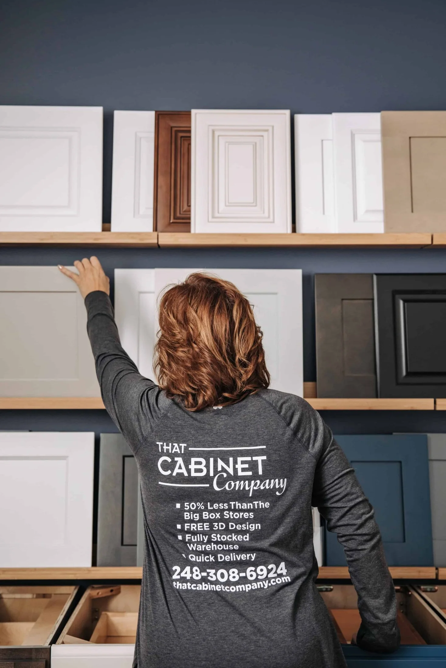 Cabinet specialist comparing door samples in the showroom